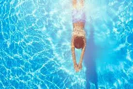 Swimming Pool With Lounge Areas amenity image at Bloom Living Seville