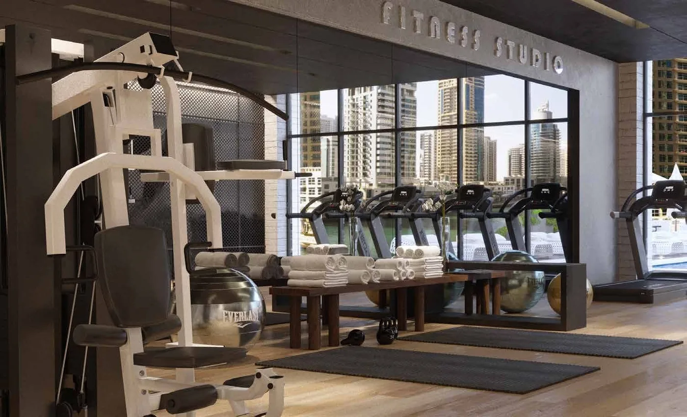Luxurious Gym Overlooking The Pool amenity image at LIV Residence