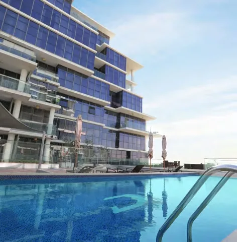 Outdoor Swimming Pool amenity image at Damac Hills - Golf Town